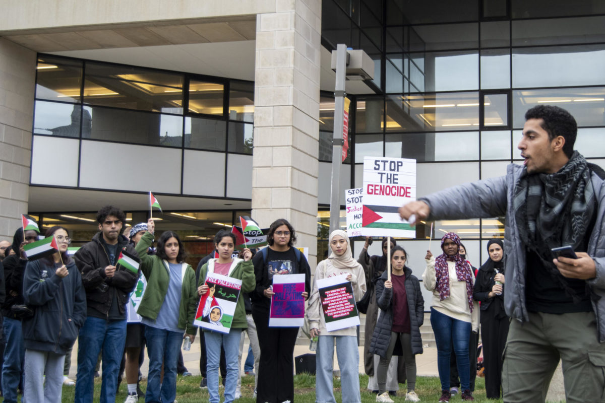 Mohammad, one of the chant leaders, speaks to the crowd during the Stand with Gaza gathering on Thursday, Oct. 19, 2023, outside of Parks Library in Ames, Iowa.