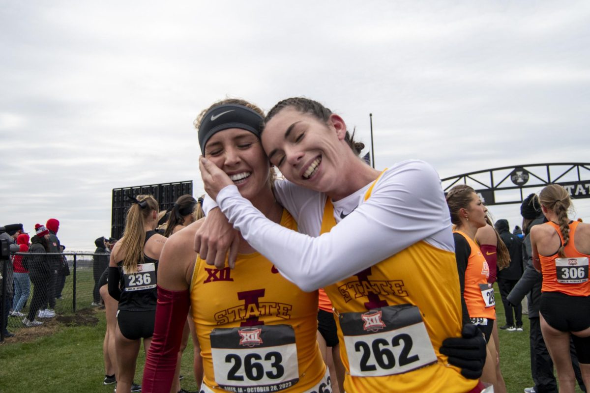 Iowa State’s Janette Schraft, left, and Maelle Porcher, right, embrace each other after running in the Big 12 Women’s Cross Country Championship on Saturday, Oct. 28, 2023, at the Iowa State University Cross Country Course in Ames, Iowa.