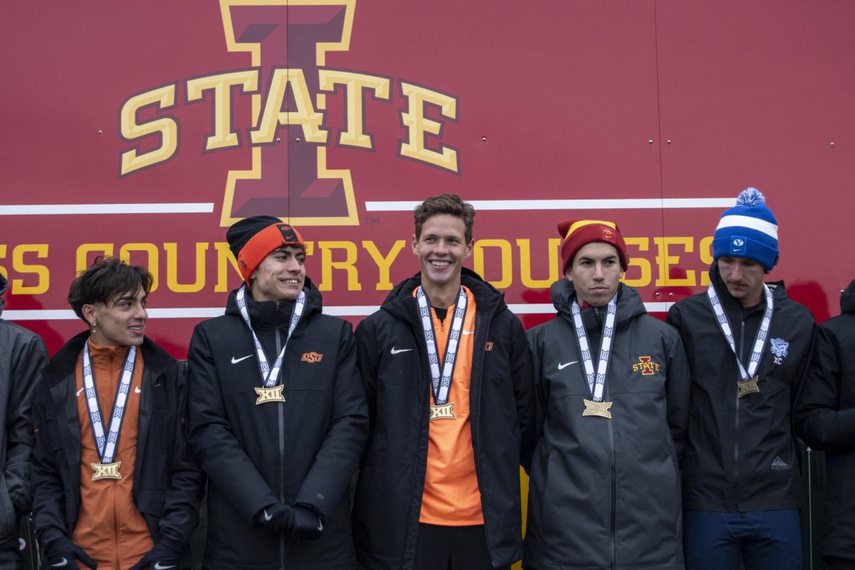 From left: Texas’ Rodger Rivera, Oklahoma State’s Jonas Price, Oklahoma State’s Will Muirhead, Iowa State’s Said Mechaal, and Brigham Young’s Joey Nokes line themselves on the podium during the Big 12 Men’s Cross Country Championship award ceremony on Saturday, Oct. 28, 2023, at the Iowa State University Cross Country Course in Ames, Iowa.