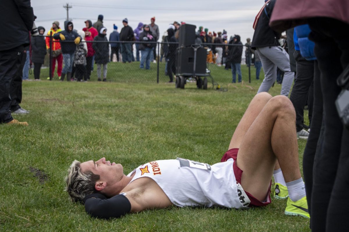 Iowa State’s Gable Sieperda lies on the ground after running in the Big 12 Men’s Cross Country Championship on Saturday, Oct. 28, 2023, at the Iowa State University Cross Country Course in Ames, Iowa.