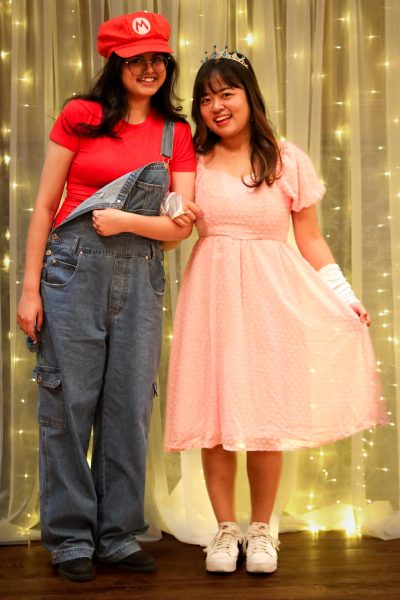 Areesha Imbesat, a freshman in pre-architecture and Moa Yoshimura, a non-degree seeking student in human sciences as Mario and Peach. The two won the award for Best Group. Imbesat said the pair happened upon the event right after leaving another costume party. Memorial Union Great Hall, Oct. 27 2023.  