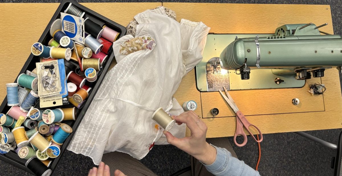 Erin Quinn, an academic advisor for the College of Design and a frequent volunteer for the Ames Repair Café, offered sewing repair services for Iowa State students on Tuesday, Oct. 24. 