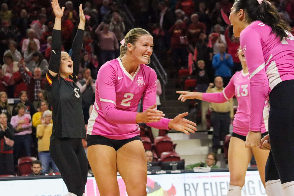Morgan+Brandt+goes+to+celebrate+with+teammate+Alexis+Engelbrecht+after+they+score+a+point+at+the+Iowa+State+vs.+Oklahoma+volleyball+game%2C+Hilton+Coliseum%2C+Oct.+28%2C+2023.+