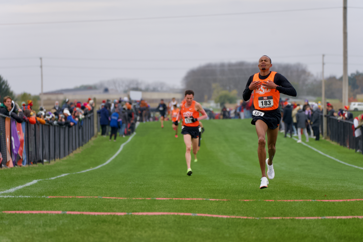 Brian Musau of OSU finishes first during the mens race with a time of 22:46.6 at the Big 12 Championship meet on Oct. 28, 2023 in Ames, Iowa.