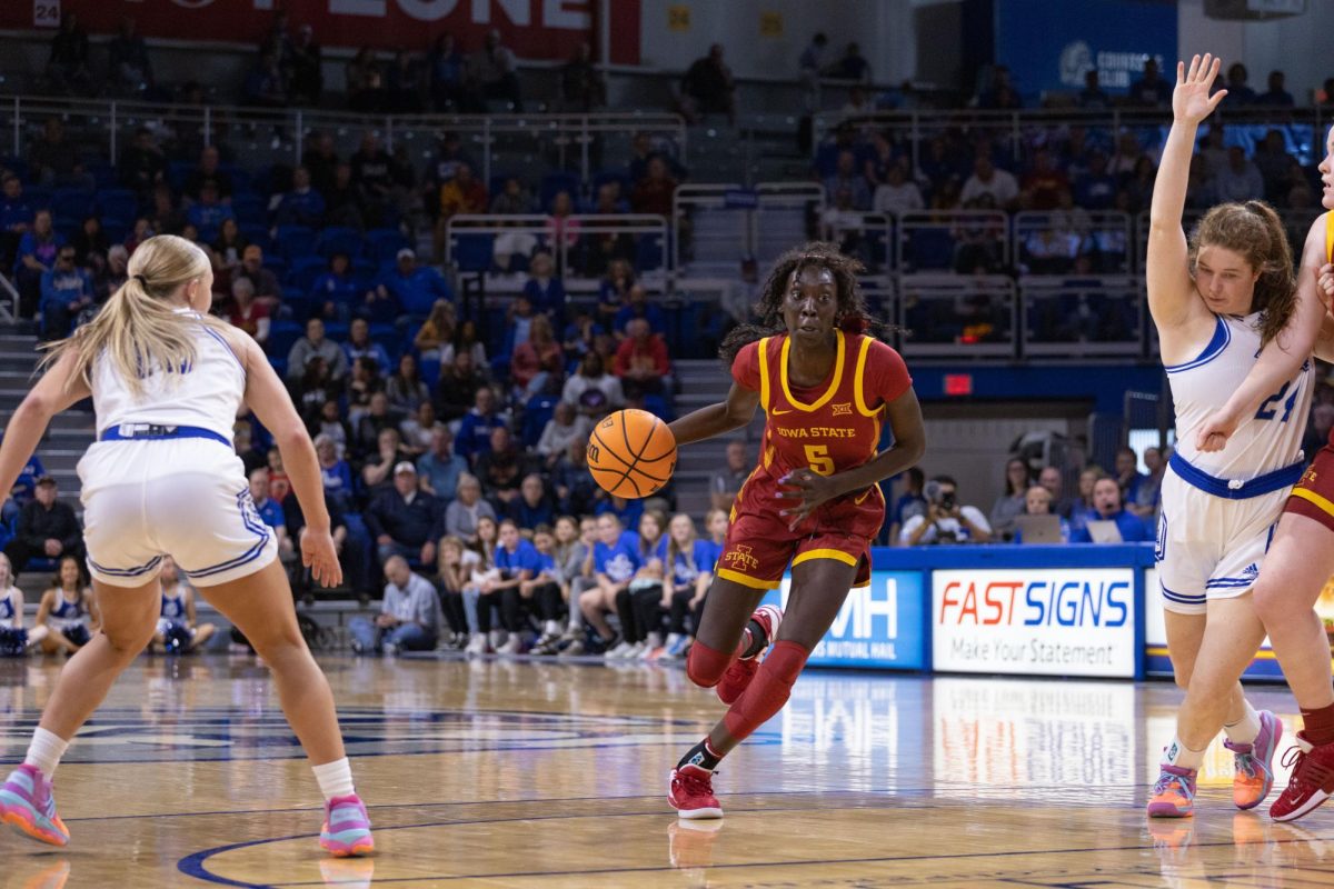Nyamer Diew dribbles the ball up-court at the Iowa State vs. Drake game, Knapp Center in Des Moines, Iowa, Nov. 12, 2023.