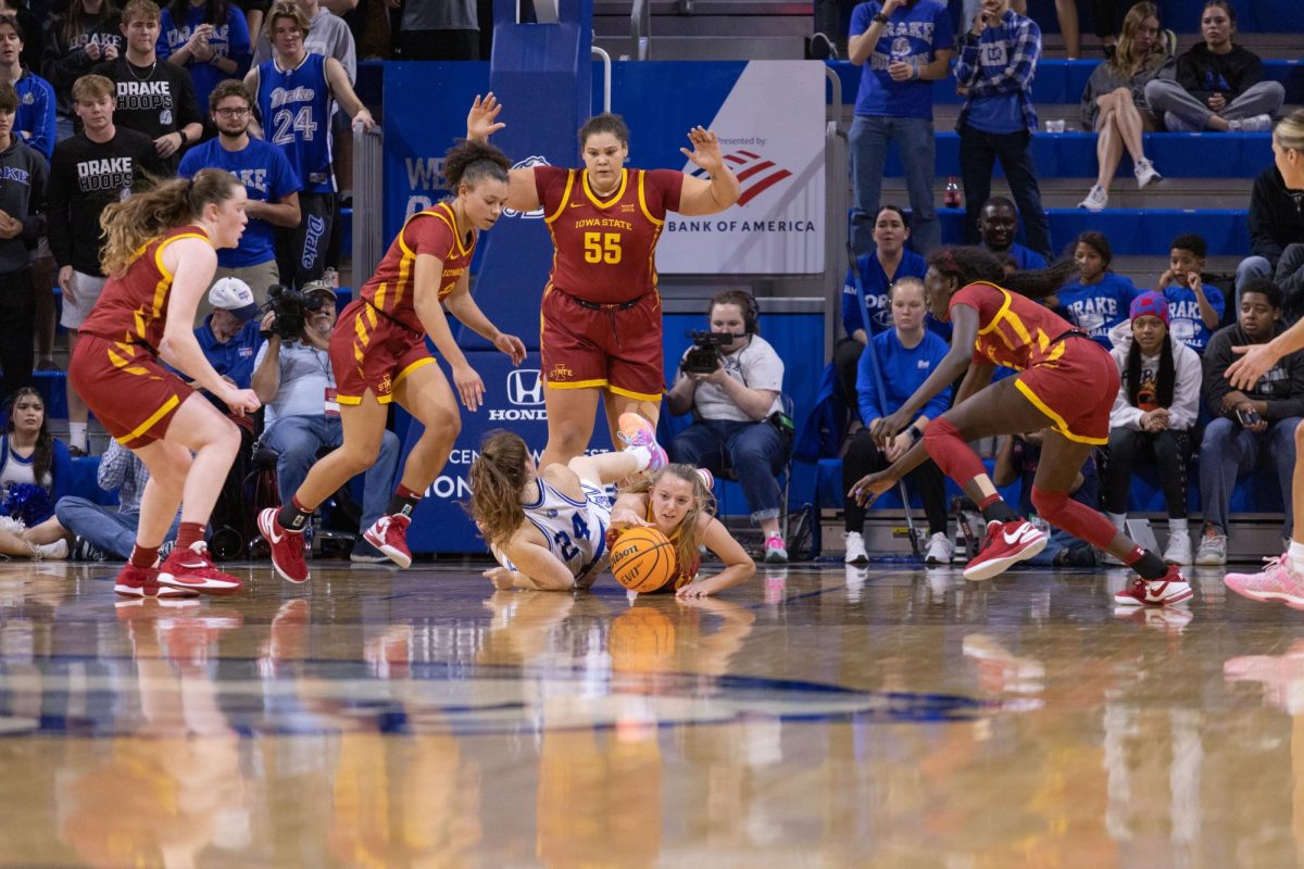 Cyclones dive for the ball at the Iowa State vs. Drake game, Knapp Center in Des Moines, Iowa, Nov. 12, 2023.