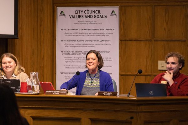 Ames City Council Member Bronwyn Beatty-Hansen laughs during City Council Meeting, Nov. 28, 2023.