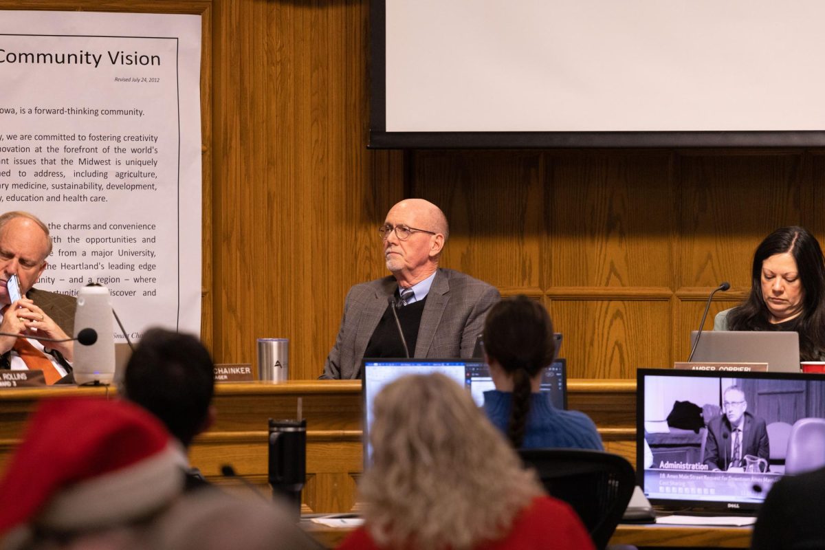 Ames Mayor John Haila listens to council-member speak during City Council Meeting, Nov. 28, 2023.
