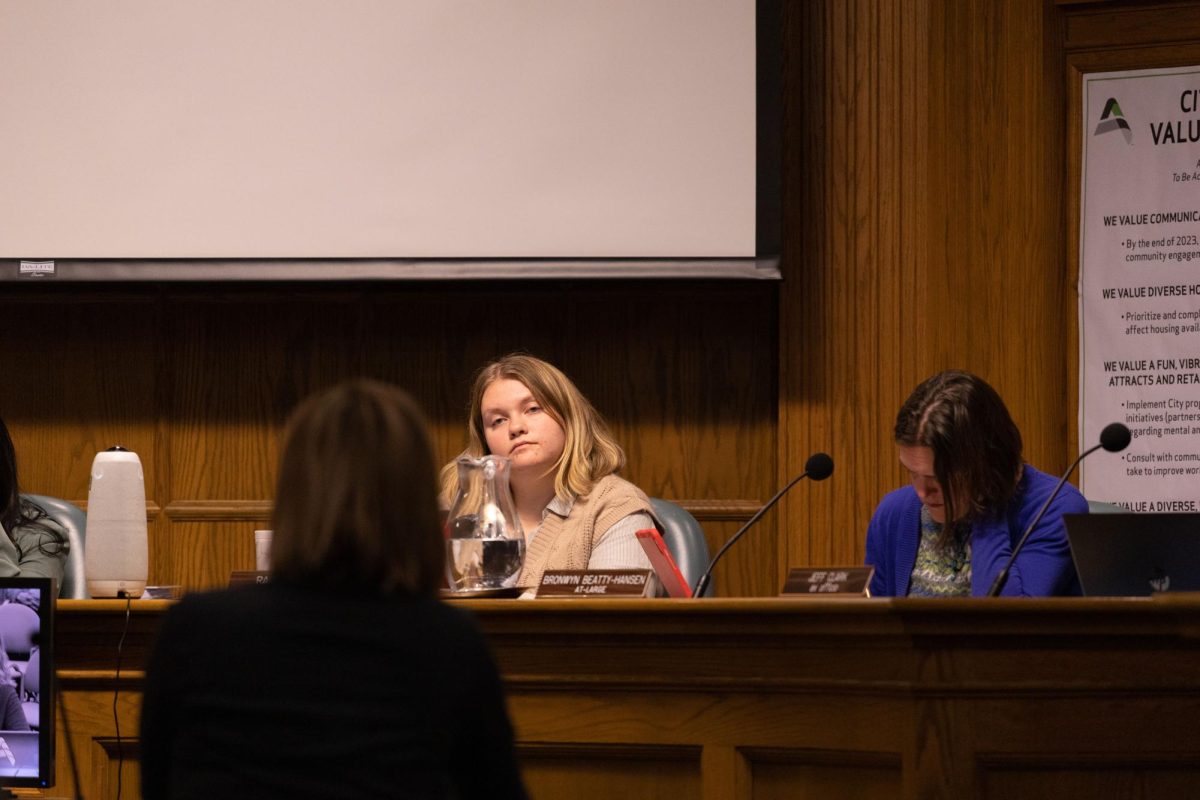 Ames City Council Member Rachel Junck listens to presentation during City Council Meeting, Nov. 28, 2023.