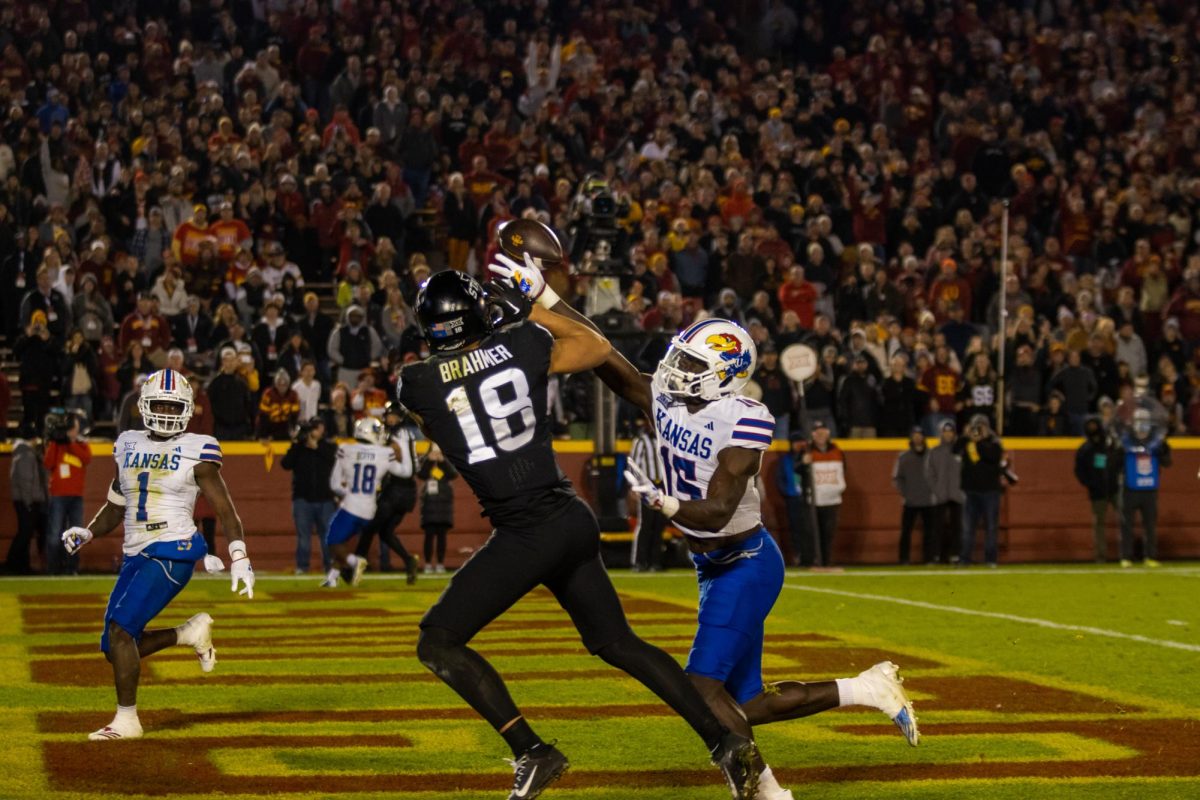 Benjamin Brahmer trying to catch a contested pass during the Iowa State vs. Kansas match, Jack Trice Stadium, Nov. 4, 2023.