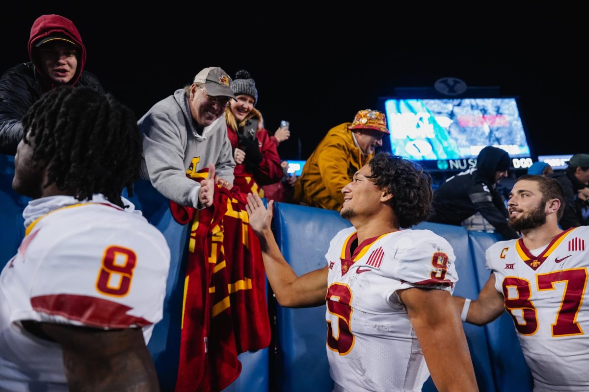 Jayden Higgins high fives Iowa State fans after defeating BYU 45-13. LaVell Edwards Stadium, Provo, Utah, Nov. 11, 2023.