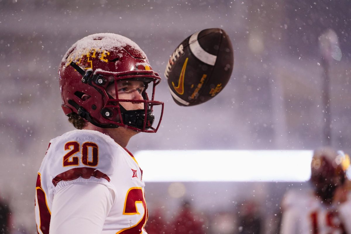 Jase Gilbert tosses a football in the air during pregame of the Iowa State vs. Kansas State football game at Bill Snyder Family Stadium on Nov. 25, 2023 in Manhattan, KS.