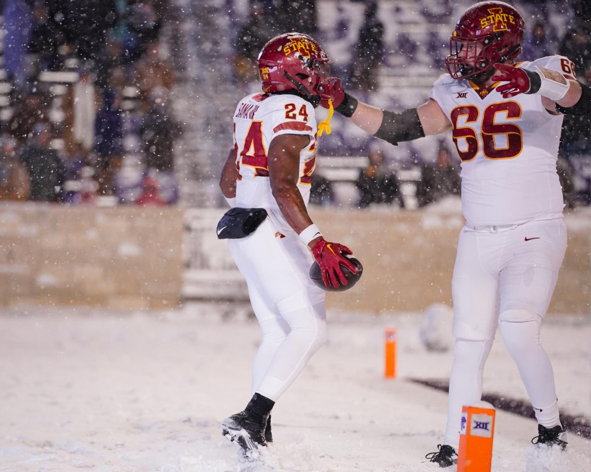 Freshman running back Abu Sama III (left) celebrates his second touchdown at the Iowa State vs. Kansas State football game at Bill Snyder Family Stadium on Nov. 25, 2023 in Manhattan, KS.