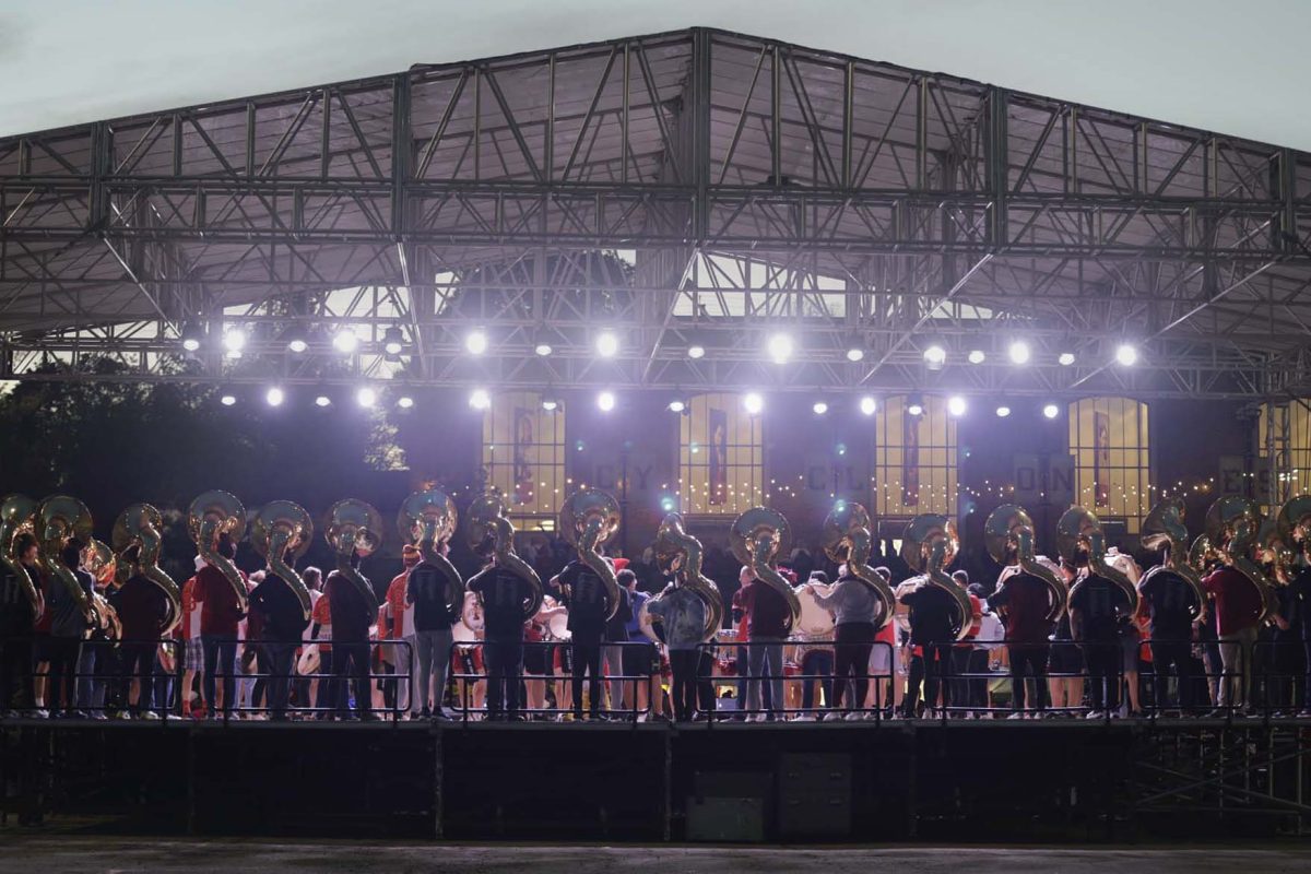 Members of the Marching Band and Spirit Squad perform on stage during the pep rally outside the Alumni Center on Friday evening, Nov. 3, 2023.