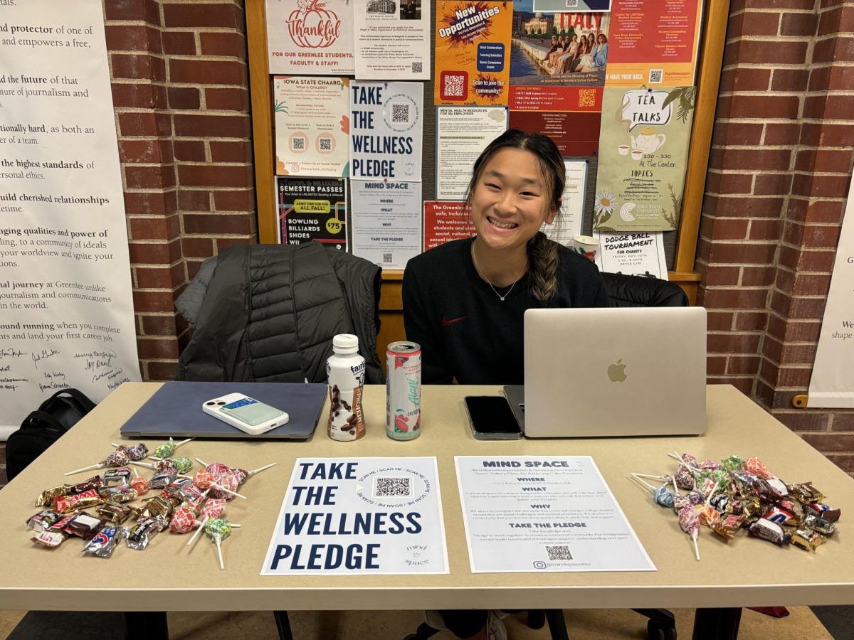 Kaia Parker, a senior in public relations, tabling for the wellness pledge at Hamilton Hall on Nov. 9, 2023. 