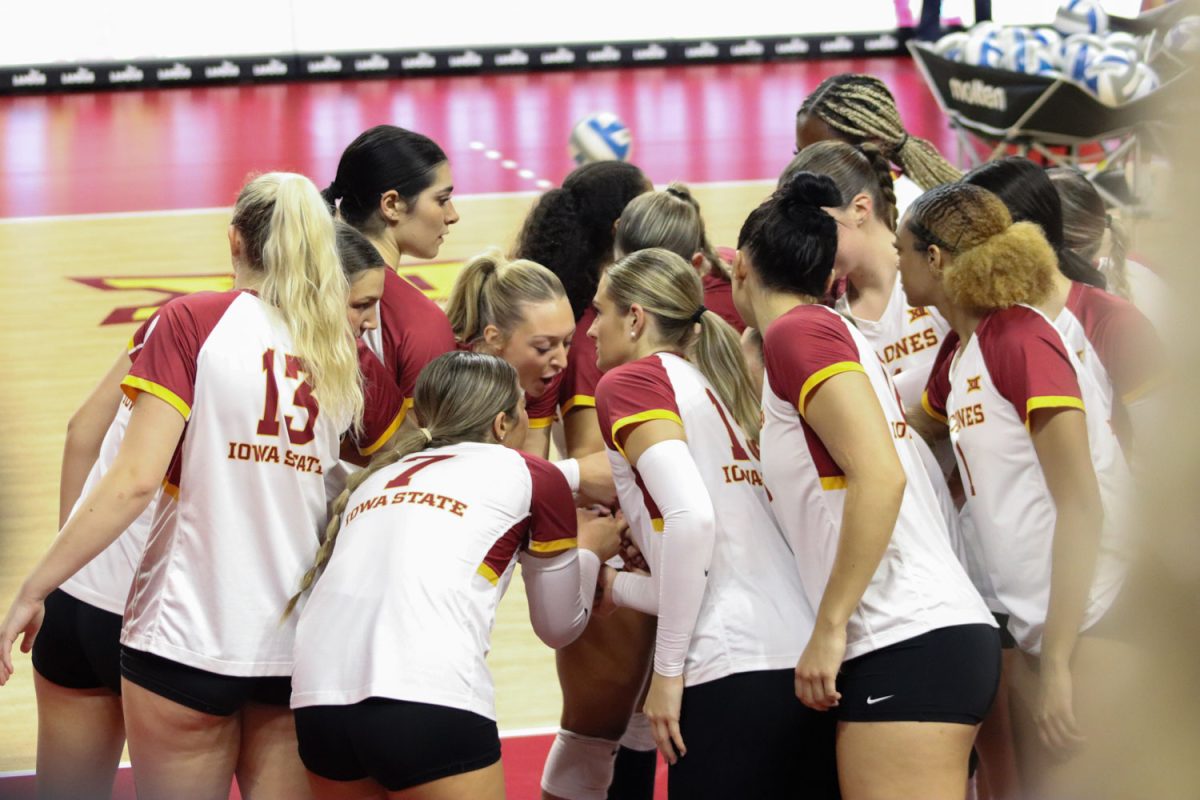 The Cyclones huddle before the volleyball game begins at the Iowa State vs. Kansas volleyball game, Hilton Coliseum, Nov. 10, 2023. 
