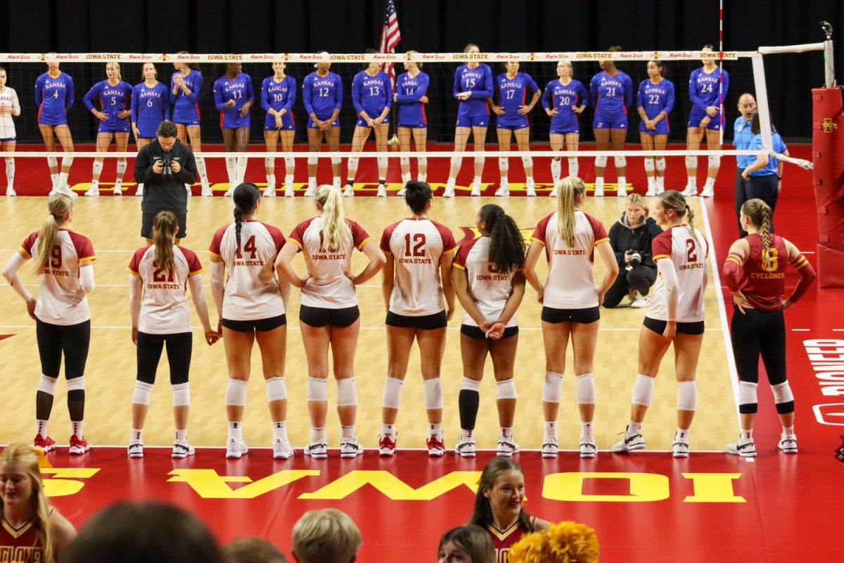 The Cyclones stand to be announced at the Iowa State vs. Kansas volleyball game, Hilton Coliseum, Nov. 10, 2023. 
