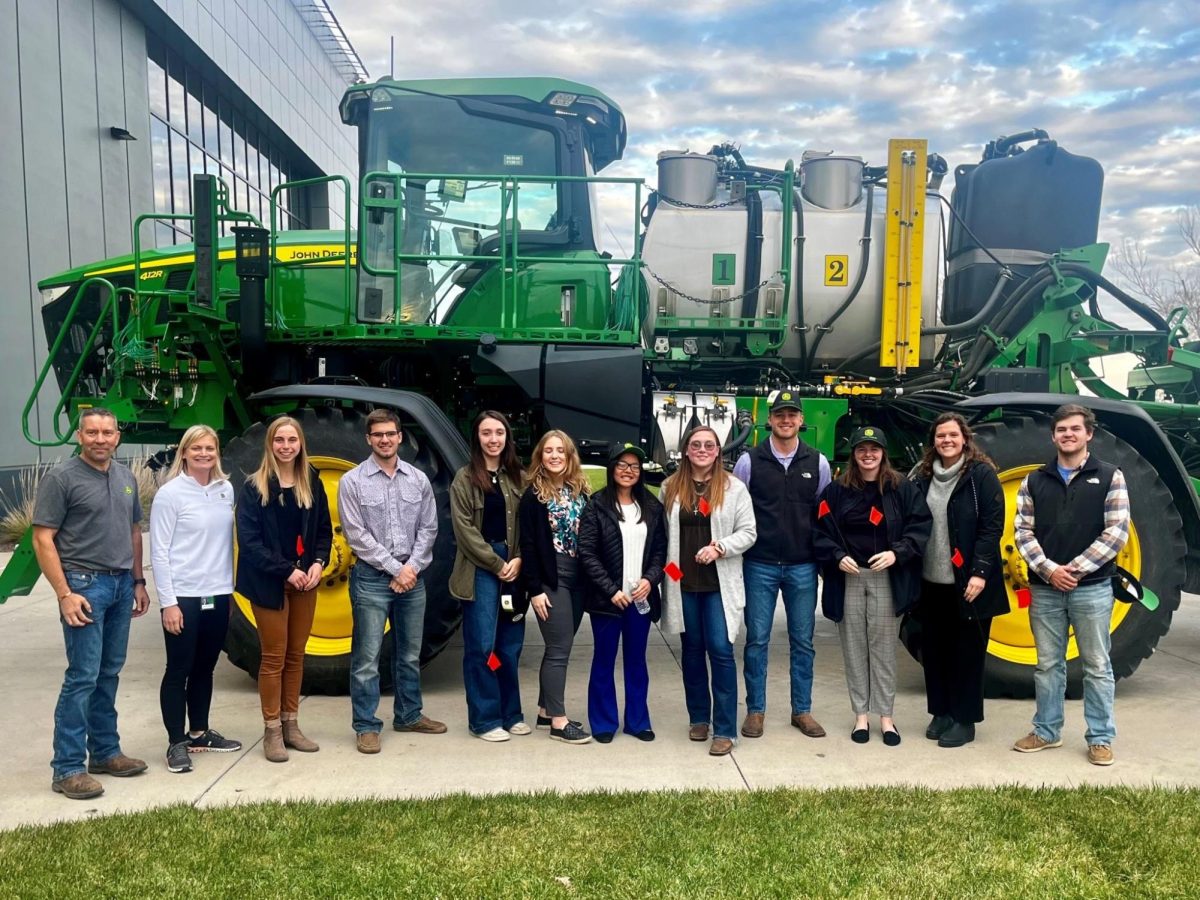 Cultivation Corridor interns pose for a picture on an industry tour. The cohort of interns spent part of the summer touring agricultural businesses. (Photo courtesy of Rebecka Larson)