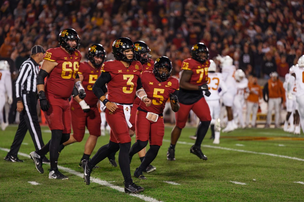 Rocco Becht leading his team off the field during the Iowa State vs. Texas football game on Nov. 18, 2023 in Jack Trice Stadium.