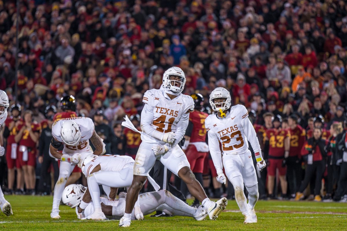 Jaylan Ford of Texas celebrating after his sack of Rocco Becht on Nov. 18, 2023 in Jack Trice Stadium during the Iowa State vs. Texas football game.