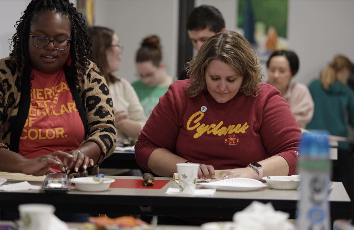 Shannon Coleman, left, an associate professor at Iowa State, and Tera Lawson, right, training, development and outreach coordinator for procurement services at Iowa State prepare sushi rolls at the Sushi Workshop held by the Culinary Science Club in the Culinary Discovery Lab on Friday, Nov. 10, 2023.