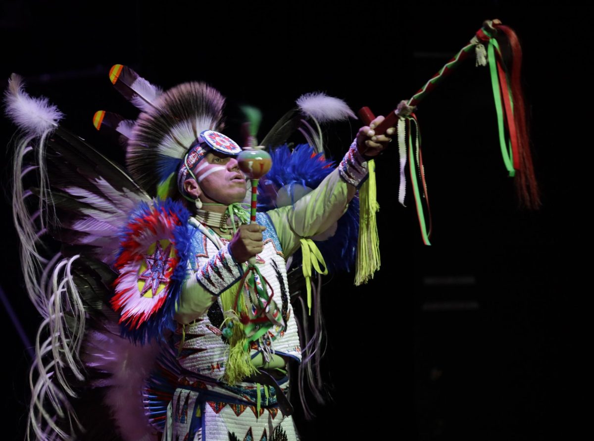 Native+American+storyteller+and+fancy+fancer%2C+Larry+Yazzie%2C+performs+in+the+Great+Hall+of+the+Memorial+Union+on+Thursday%2C+Nov.+30%2C+2023.+Yazzie+is+a+member+of+the+Meskwaki+Nation.+Located+near+Tama%2C+it+is+the+only+federally+recognized+tribe+in+Iowa.+