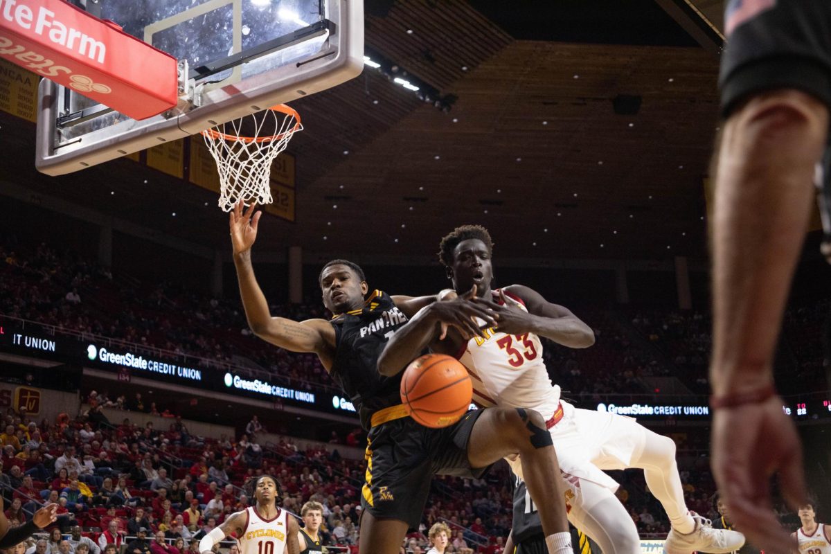 Omaha Biliew loses the ball and falls with a defender during the Iowa State vs. Prairie View A&M mens basketball Game, Hilton Coliseum, Dec. 10, 2023.