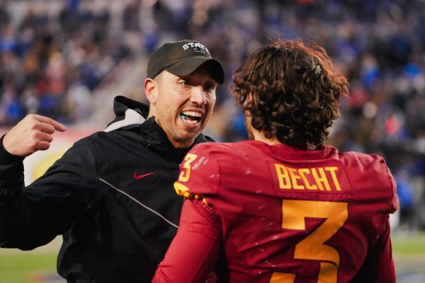 Matt Campbell speaks with Rocco Becht during the third quarter of the Iowa State vs. Memphis 2023 AutoZone Liberty Bowl, Simmons Bank Liberty Stadium, Dec. 29. 2023.