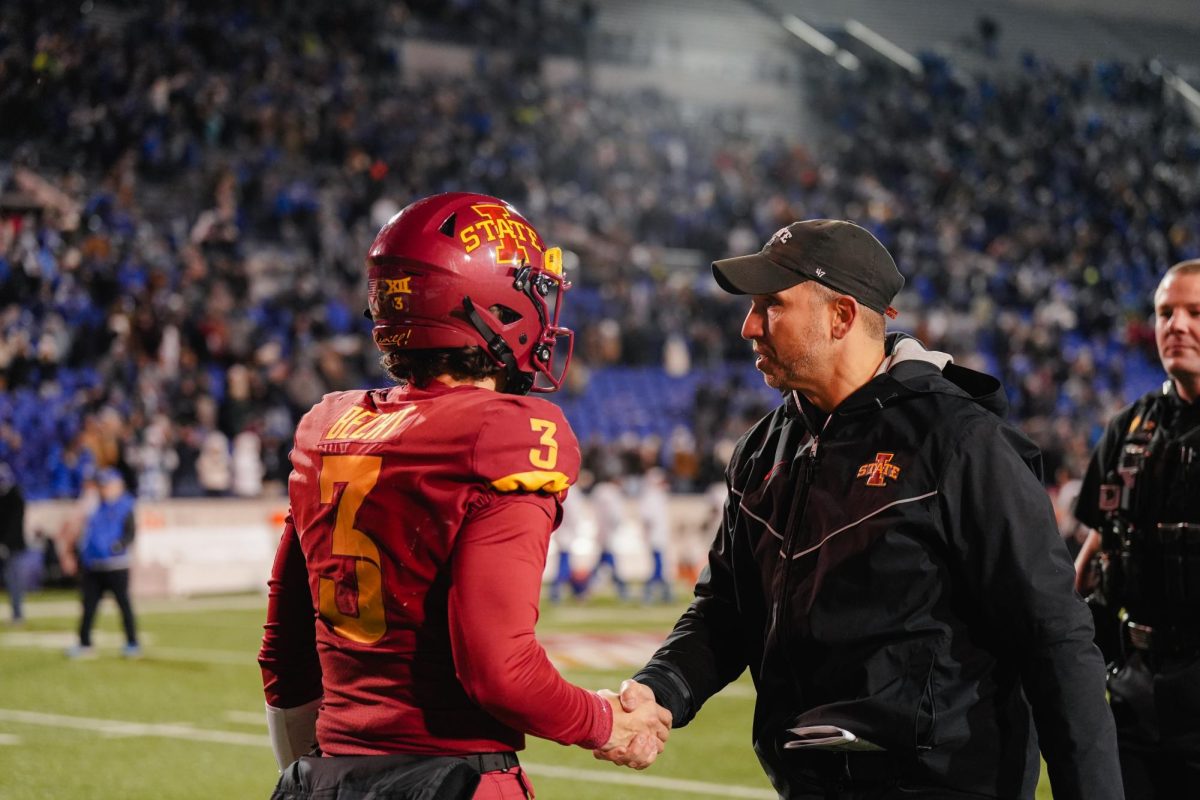 Freshman quarterback Rocco Becht shakes hands with head coach Matt Campbell after a 36-26 loss to Memphis in the 2023 AutoZone Liberty Bowl, Simmons Bank Liberty Stadium, Dec. 29, 2023.