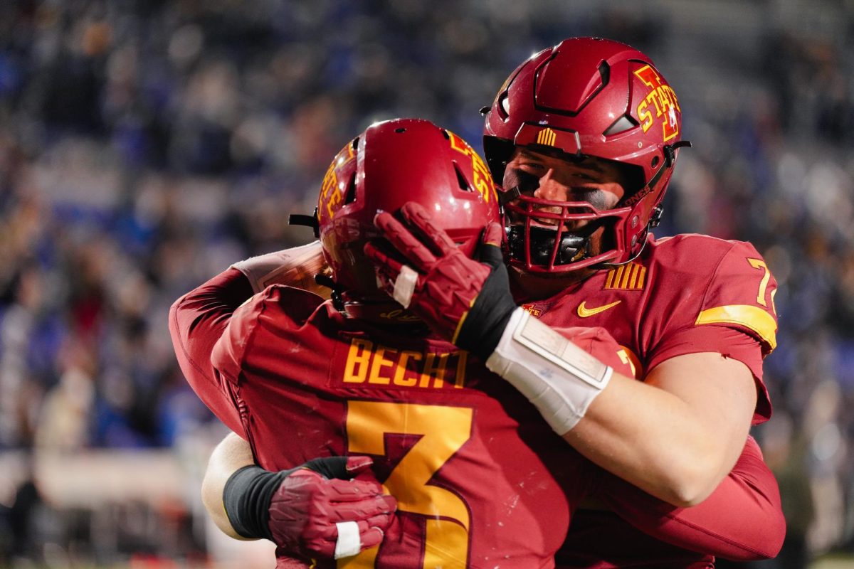 Offensive Lineman Jake Remsburg hugs quarterback Rocco Becht after the 26-36 loss against Memphis in the Iowa State vs. Memphis 2023 AutoZone Liberty Bowl, Simmons Bank Liberty Stadium, Dec. 29. 2023.