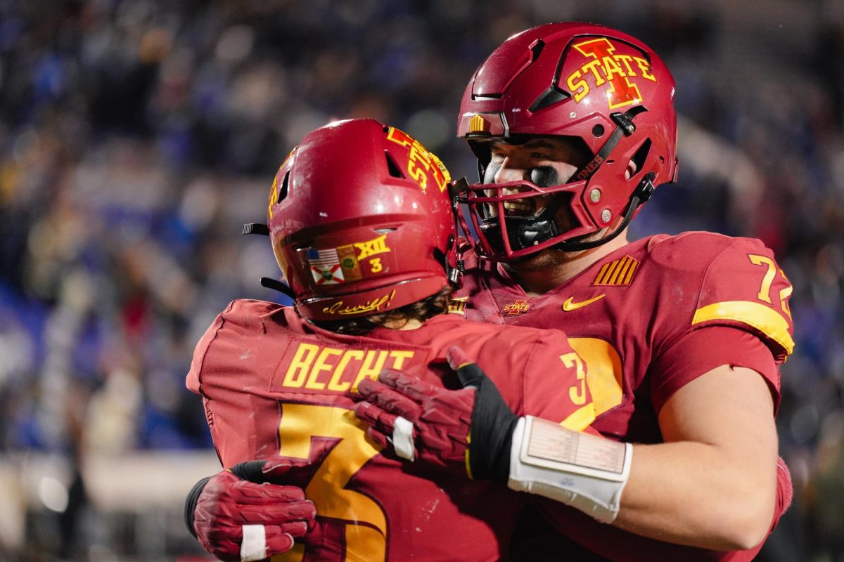 Offensive Lineman Jake Remsburg hugs quarterback Rocco Becht after the 26-36 loss against Memphis in the Iowa State vs. Memphis 2023 AutoZone Liberty Bowl, Simmons Bank Liberty Stadium, Dec. 29. 2023.