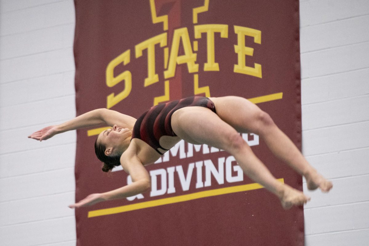 An Iowa State dive team member competes in the three-meter dive during the meet against Iowa on Friday, Dec. 8, 2023, at Beyer Hall in Ames, Iowa.