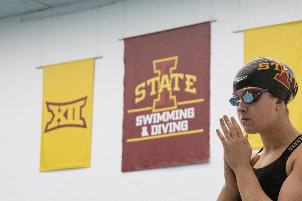 An Iowa State swim team member waits to step onto the block during the meet against Iowa on Friday, Dec. 8, 2023, at Beyer Hall in Ames, Iowa.