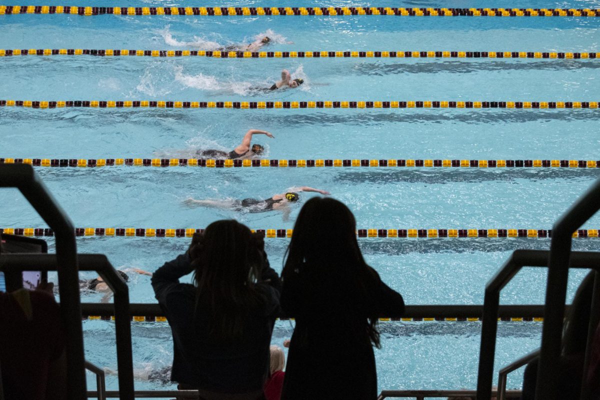 Iowa State and Iowa swim team members compete during the annual Cy-Hawk meet on Friday, Dec. 8, 2023, at Beyer Hall in Ames, Iowa.