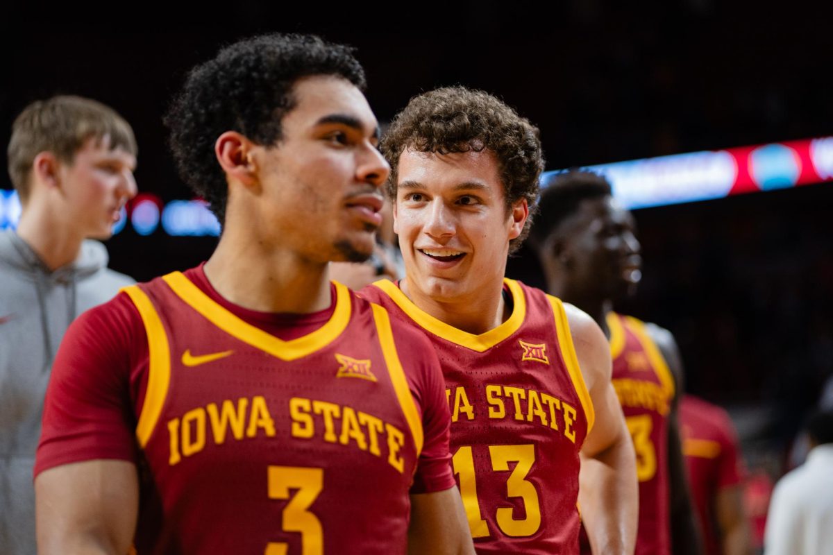 Cade Kelderman speaks with Tamin Lipsey while walking off the court after the Iowa State vs. Eastern Illinois University men's basketball game, Hilton Coliseum, Dec. 21, 2023.