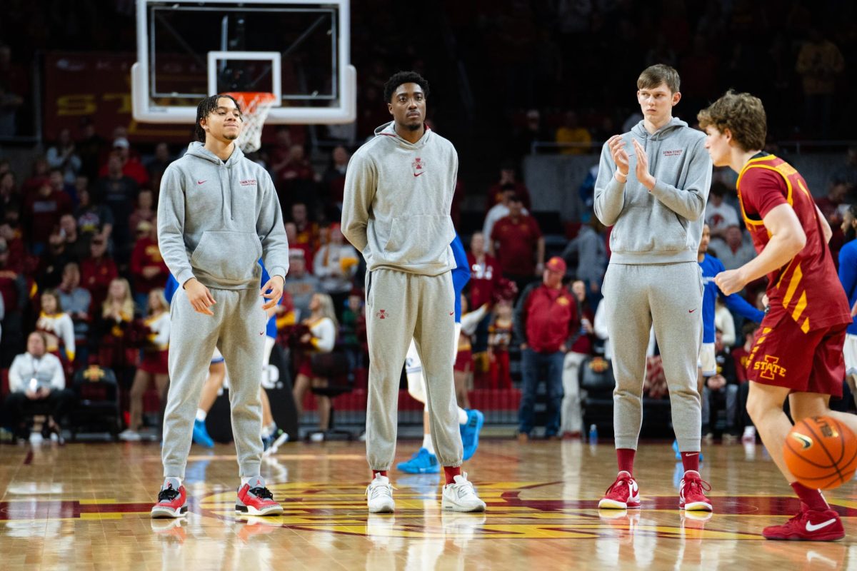 Grey sweat suits are worn by members of the Iowa State mens's basketball team who are red shirted or injured. Pregame of the Iowa State vs. Eastern Illinois University men's basketball game, Hilton Coliseum, Dec. 21, 2023.