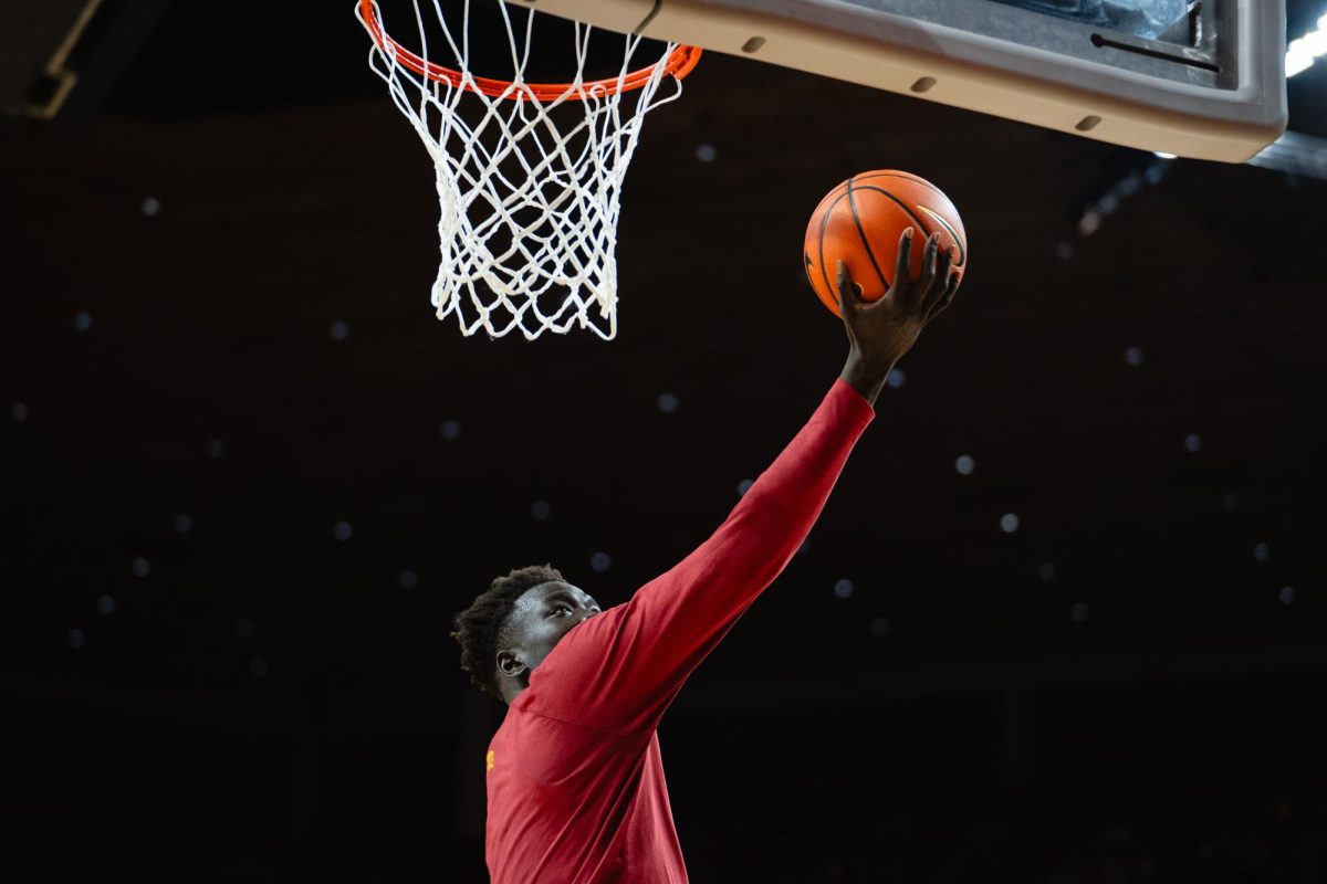 Omaha Biliew goes up for a layup during warmups of the Iowa State vs. Eastern Illinois University men's basketball game, Hilton Coliseum, Dec. 21, 2023.