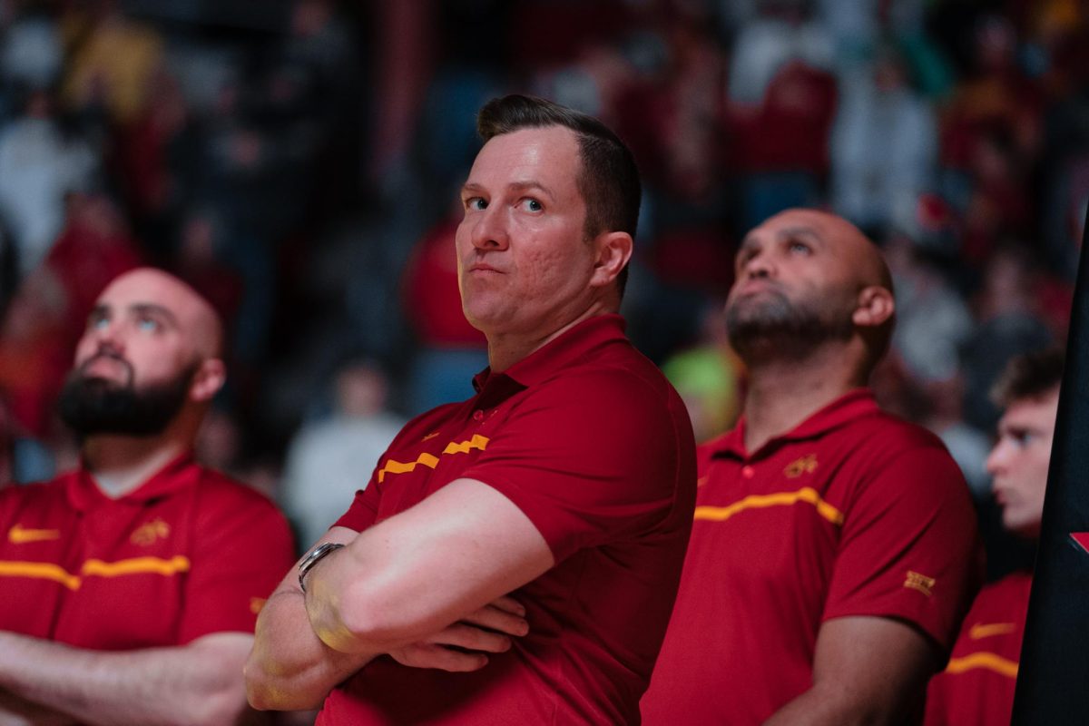 T.J. Otzelberger looks at the opposing team across the court as the Iowa State intro video plays before the Iowa State vs. Eastern Illinois University mens basketball game, Hilton Coliseum, Dec. 21, 2023.