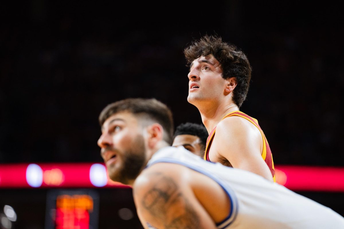 Freshman forward Milan Momcilovic watches his teammate shoot a free throw during the Iowa State vs. Eastern Illinois University men's basketball game, Hilton Coliseum, Dec. 21, 2023.