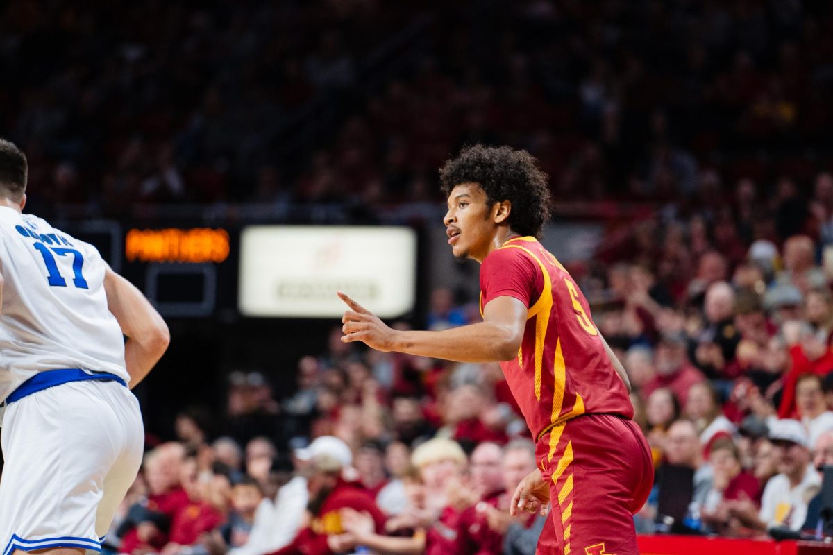 Curtis Jones point to a teammate across the court after making a three point shot in the first half of the Iowa State vs. Eastern Illinois University men's basketball game, Hilton Coliseum, Dec. 21, 2023.