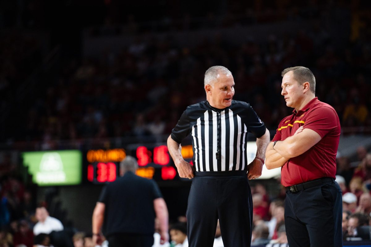 Head Coach T.J. Otzelberger speaks with one of the referees during the Iowa State vs. Eastern Illinois University men's basketball game, Hilton Coliseum, Dec. 21, 2023.