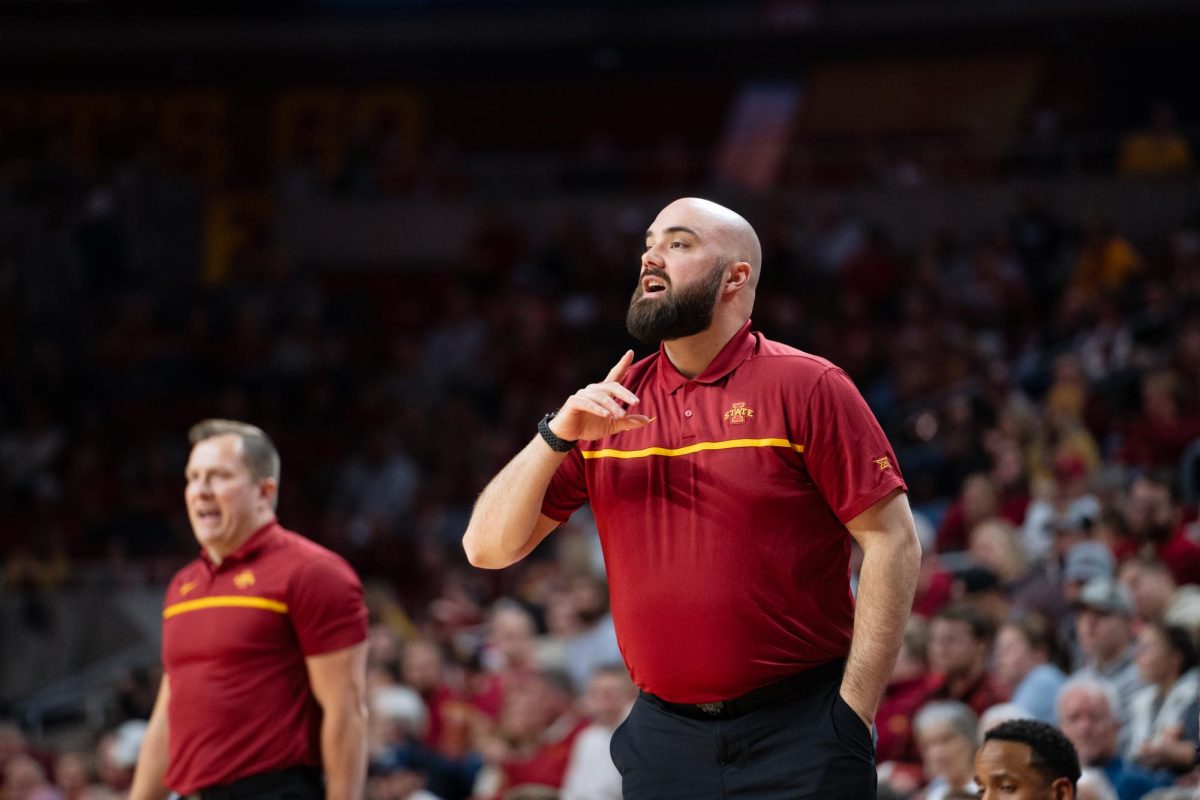 Assistant Coach Nate Schmidt communicates with the Iowa State men's basketball team during the Iowa State vs. Eastern Illinois University men's basketball game, Hilton Coliseum, Dec. 21, 2023.