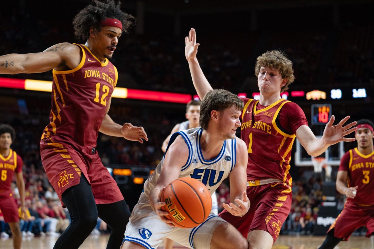 Robert Jones and Jackson Paveletzke attempt to box out EIU guard Dan Luers in the second half of the Iowa State vs. Eastern Illinois University men's basketball game, Hilton Coliseum, Dec. 21, 2023.