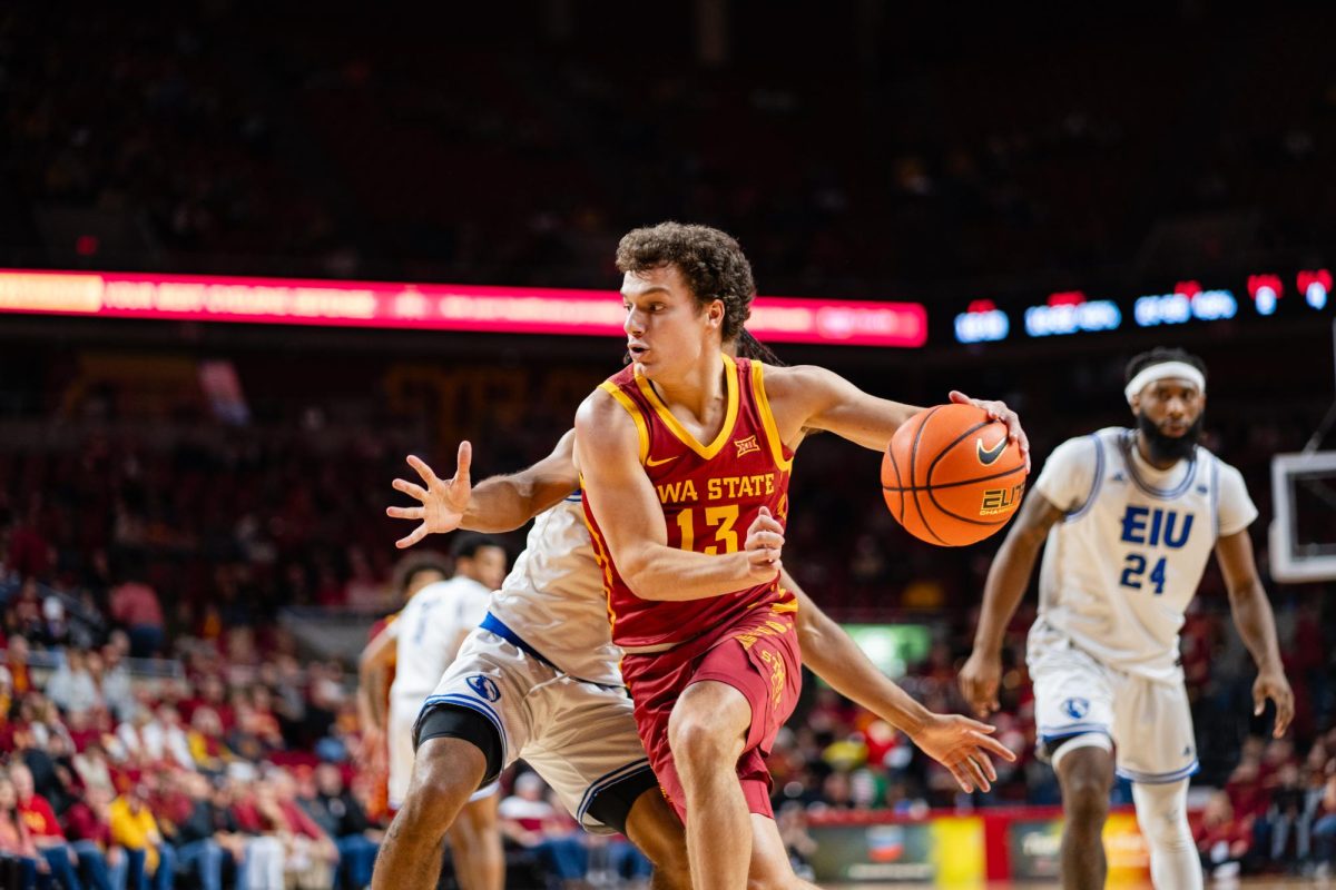 Freshamn guard Cade Kelderman drives the ball up the court during the Iowa State vs. Eastern Illinois University men's basketball game, Hilton Coliseum, Dec. 21, 2023.