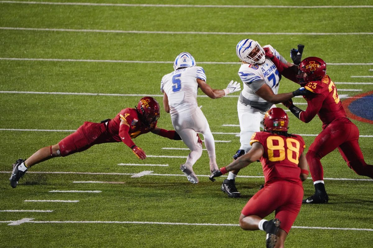 Jeremiah Cooper dives to stop Memphis running back Sutton Smith during the 2023 AutoZone Liberty Bowl, Simmons Bank Liberty Stadium, Dec. 29. 2023.