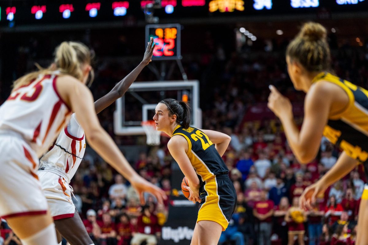 Caitlin Clark looking for passing options during the Iowa State vs. Iowa match, Hilton Coliseum, Dec. 6, 2023.