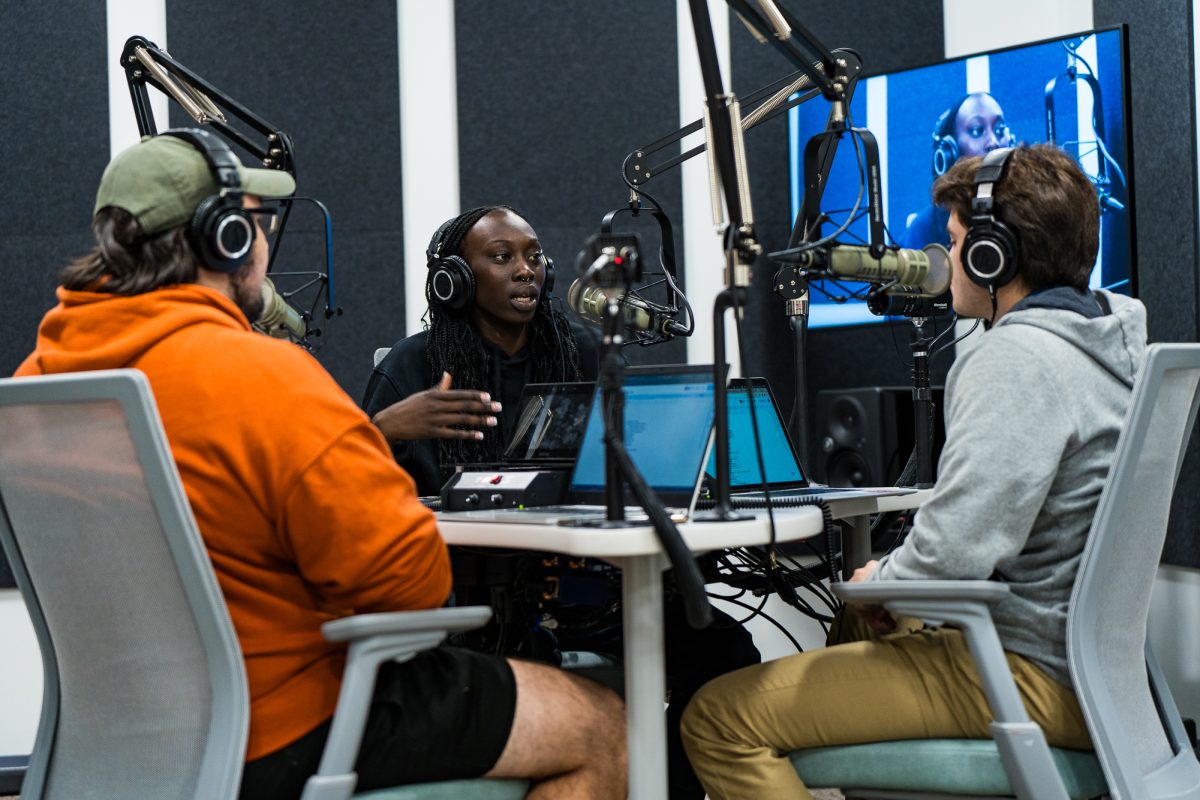 Iowa State Womens Basketball player Nyamer Diew speaks with Assistant Sports Editor Logan shanks (right) and sports editor Christian Royston (left) on Dec. 7, 2023 for the Daily Dish podcast in the Student Innovation Center Podcast Studio.