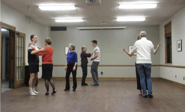  Valerie Williams guides participants through a dance sequence. Williams is approaching her 21st year of instructing Argentine tango lessons at Iowa State. 