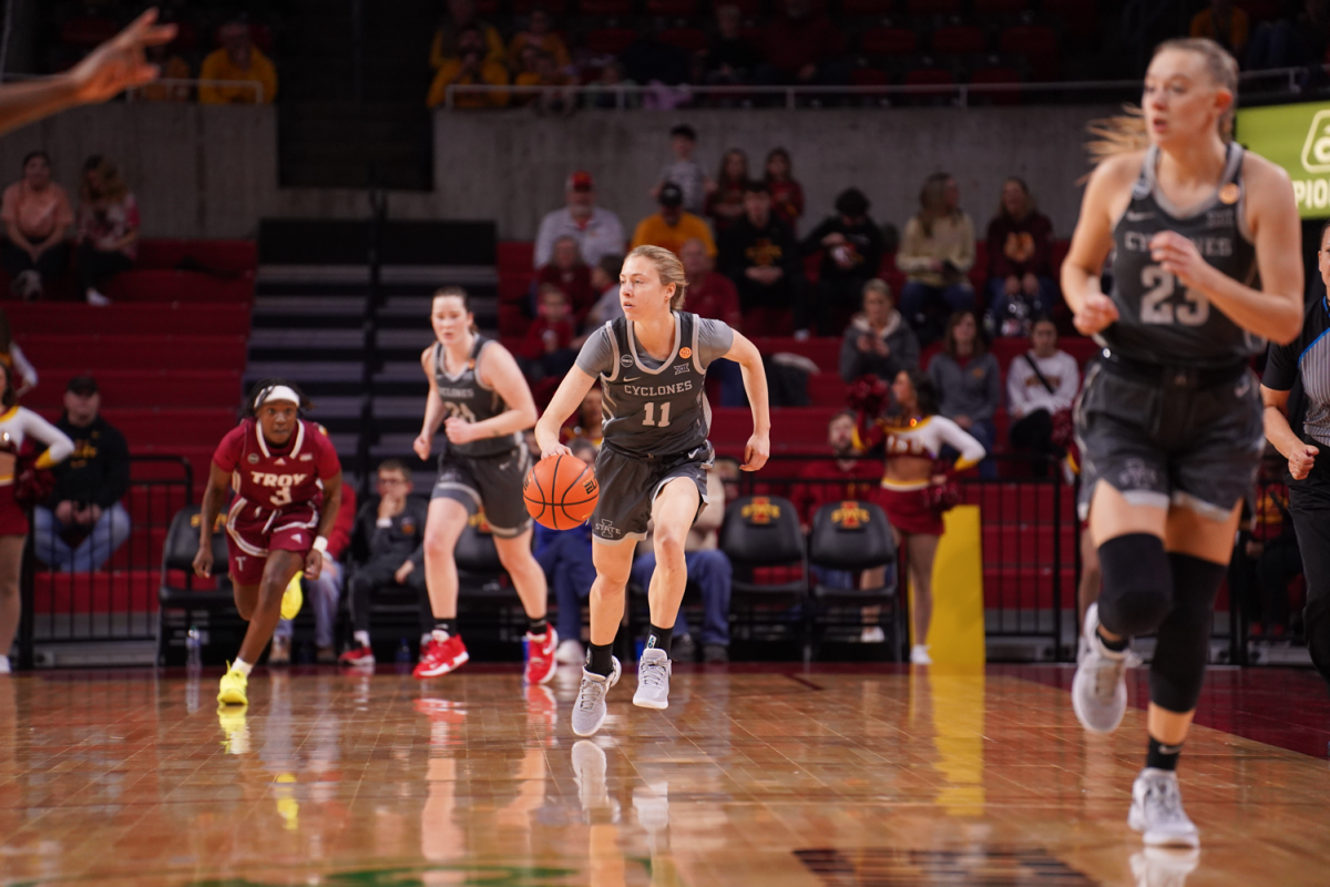 Emily Ryan brings the ball up the court against Troy at Hilton Coliseum on Dec. 17, 2023.