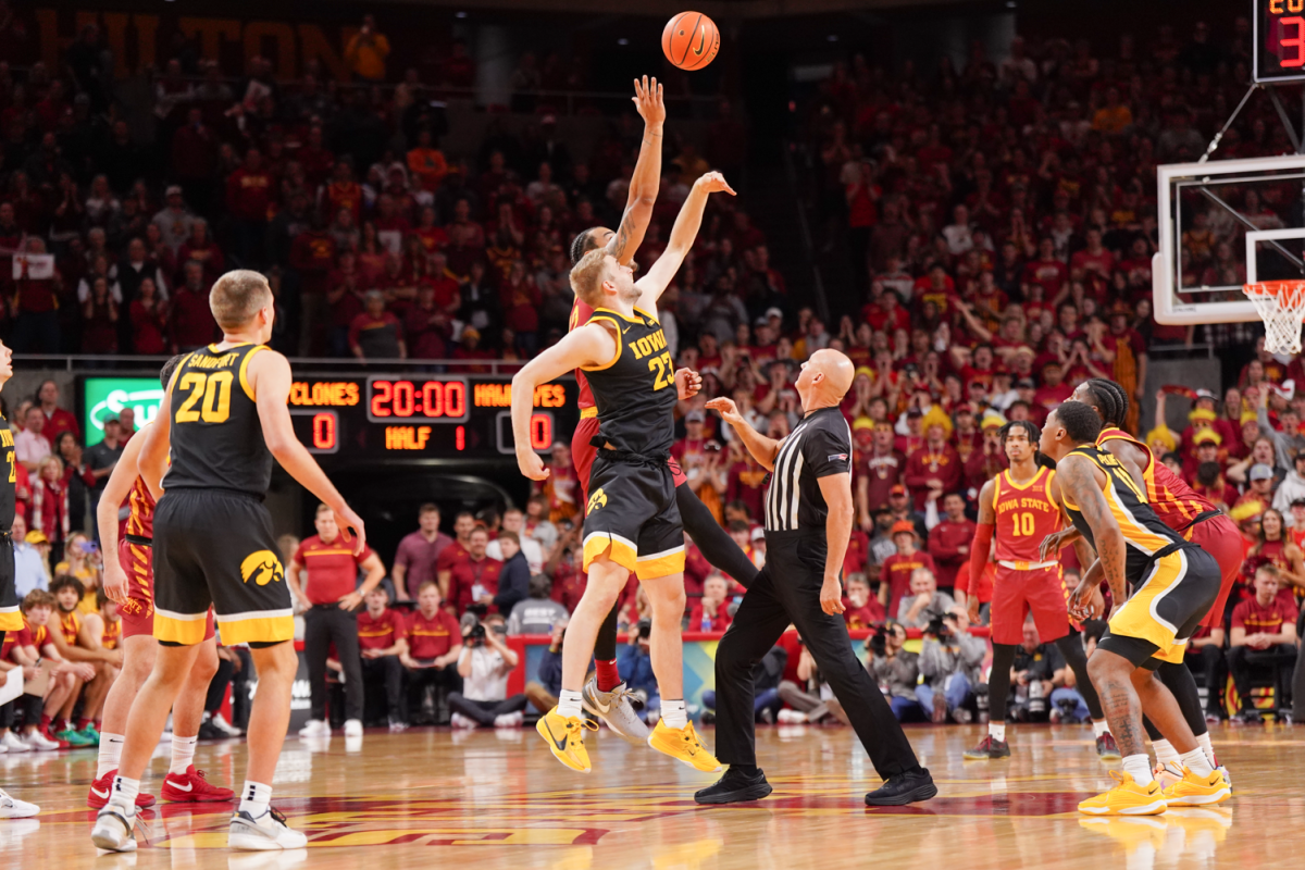 The ball is tipped to begin the Iowa Corn CyHawk series between Iowa and Iowa State at Hilton Coliseum on Dec. 7, 2023.